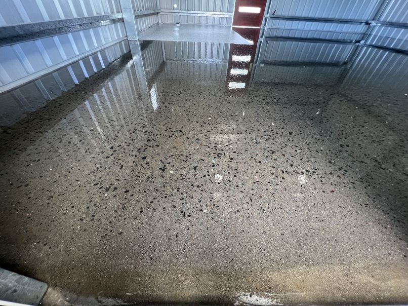Sealed flake epoxy floor inside a small colourbond garden shed