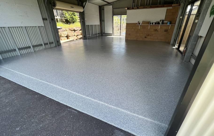 A shed floor finished in grey flake epoxy
