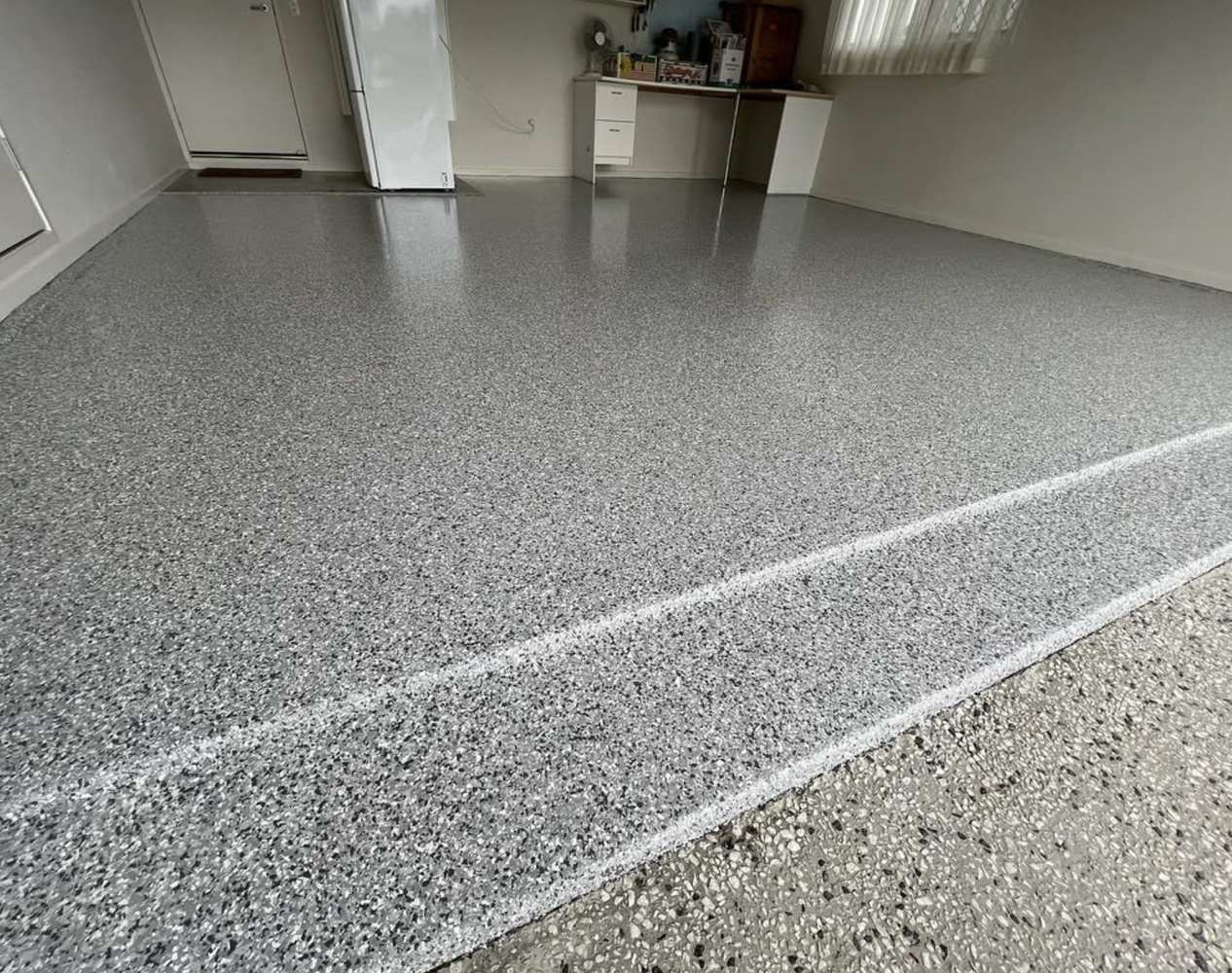 The same garage finished in grey flake epoxy